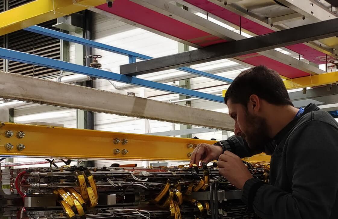Image of technician working on sensor at the Laboratory for Accelerator Physics and Instrumentation
